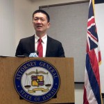 FILE - In this Feb. 3, 2017, file photo, Hawaii Attorney General Doug Chin speaks at a news conference in Honolulu announcing the state of Hawaii has filed a lawsuit challenging President Donald Trump's travel ban. Hawaii is planning to challenge Trump's revised travel ban. A motion filed in federal court on Tuesday, March 7, 2017, in Honolulu says the state wants to amend its existing lawsuit challenging Trump's previous order.  (AP Photo/Audrey McAvoy, File)