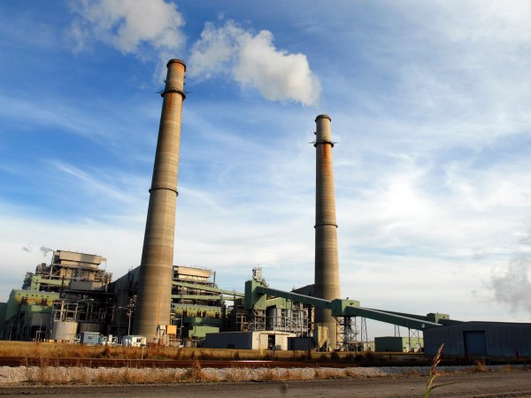 **ADVANCE FOR WEEKEND EDITIONS, DEC. 1-2** Smoke stacks from the NRG power plant located just outside of Jewett, Texas tower over Texas Highway 39, Nov. 28, 2007. The plant provides 250 full-time jobs for Limestone county. Jewett is one of four towns, two in Texas and two in Illinois, competing for the new state-of-the-art FutureGen power plant developers say would emit almost no pollution, turning coal into gas while capturing and storing climate-changing carbon dioxide deep underground. (AP Photo/Nick Simonite)