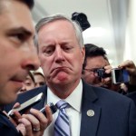 Rep. Mark Meadows, R-N.C., center, the chairman of the Freedom Caucus, reacts to a reporter's question, as he walks after a Freedom Caucus meeting on Capitol Hill, Thursday, March 23, 2017, in Washington. (AP Photo/Alex Brandon)