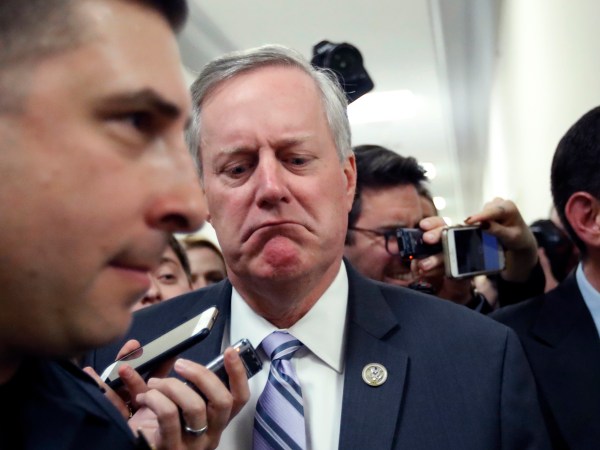 Rep. Mark Meadows, R-N.C., center, the chairman of the Freedom Caucus, reacts to a reporter's question, as he walks after a Freedom Caucus meeting on Capitol Hill, Thursday, March 23, 2017, in Washington. (AP Photo/Alex Brandon)