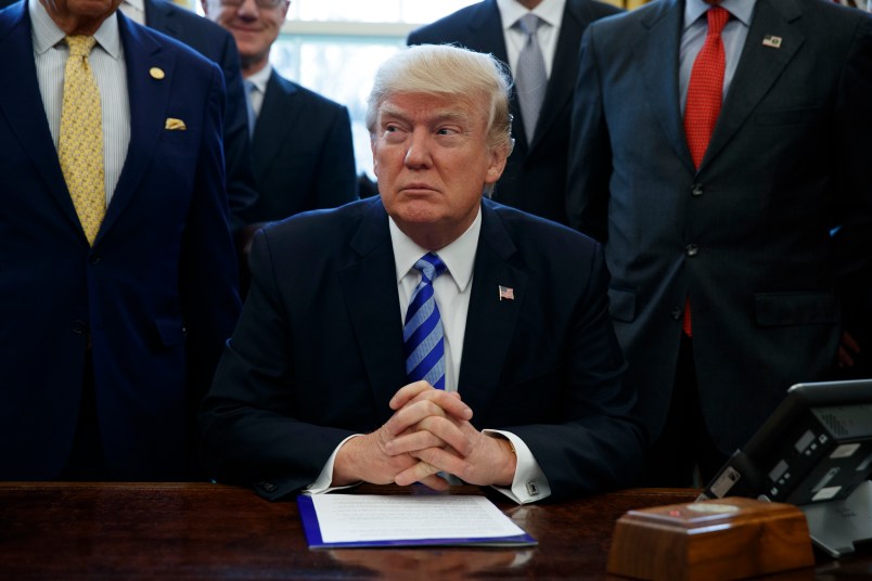 President Donald Trump announces the approval of a permit Friday to build the Keystone XL pipeline, clearing the way for the $8 billion project, in the Oval Office of the White House, Friday, March 24, 2017, in Washington. (AP Photo/Evan Vucci)