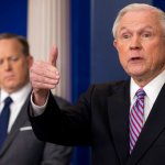 Attorney General Jeff Sessions, right, accompanied by White House press secretary Sean Spicer, left, talks to the media during the daily press briefing at the White House, Monday, March 27, 2017, in Washington. (AP Photo/Andrew Harnik)