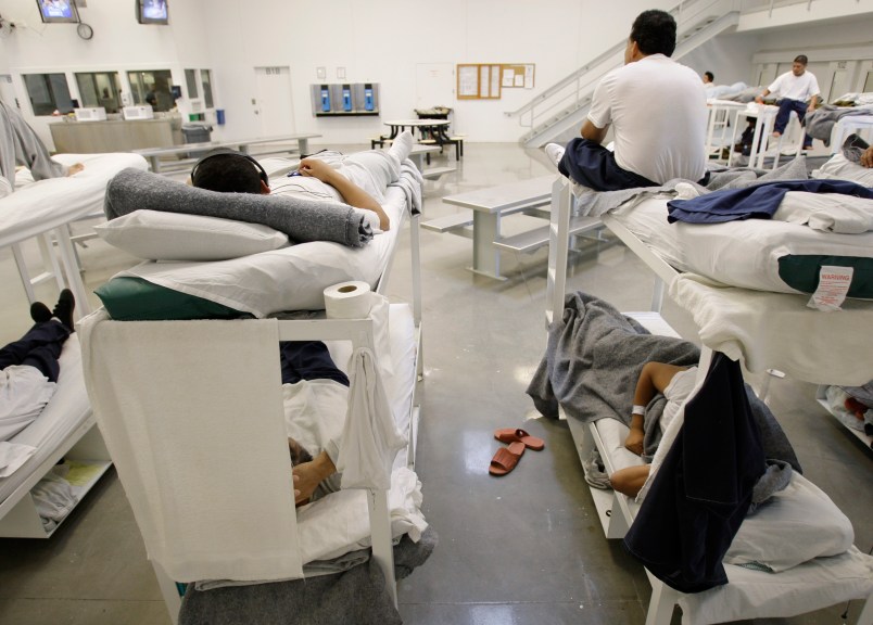 ** ATTENTION HOLD FOR GRAHAM MORRISON ** Detainees are shown resting on bunks inside the "B" cell and bunk unit of the Northwest Detention Center in Tacoma, Wash. Friday, Oct. 17, 2008. The facility is operated by The GEO Group Inc. under contract from U.S. Immigrations and Customs Enforcement, and houses people whose immigration status is in question or who are waiting for deportation or deportation hearings. (AP Photo/Ted S. Warren)
