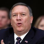 CIA Director-designate Rep. Michael Pompeo, R-Kan. testifies on Capitol Hill in Washington, Thursday, Jan. 12, 2017, at his confirmation hearing before the Senate Intelligence Committee. Seated behind Pompeo is his wife Susan Pompeo, right, and their son Nick, left. (AP Photo/Manuel Balce Ceneta)