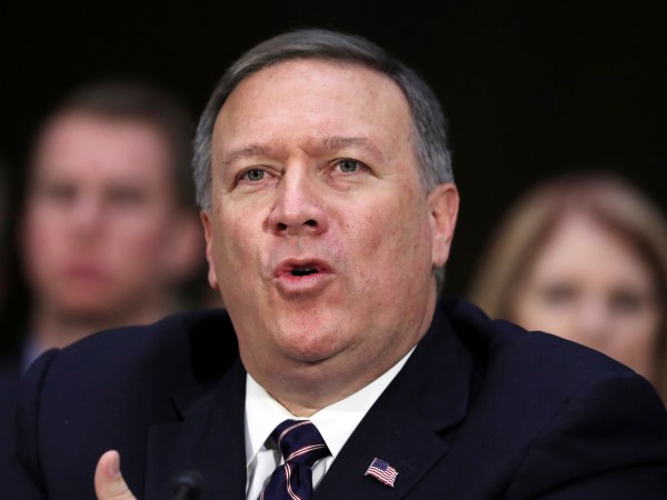CIA Director-designate Rep. Michael Pompeo, R-Kan. testifies on Capitol Hill in Washington, Thursday, Jan. 12, 2017, at his confirmation hearing before the Senate Intelligence Committee. Seated behind Pompeo is his wife Susan Pompeo, right, and their son Nick, left. (AP Photo/Manuel Balce Ceneta)