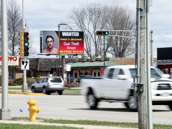 An electronic billboard on Milton Ave. in Janesville, Wis., shows a wanted sign for Joseph Jakubowski as cars drive by Thursday, April 6, 2017.