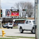 An electronic billboard on Milton Ave. in Janesville, Wis., shows a wanted sign for Joseph Jakubowski as cars drive by Thursday, April 6, 2017.