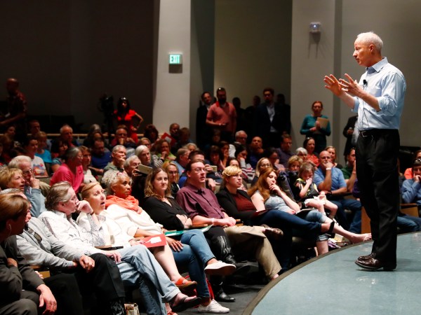 U.S. Rep. Mike Coffman, R-Colo., addresses constituents during a town hall meeting in a hall on the campus of the University of Colorado Medical School late Wednesday, April 12, 2017, in Aurora, Colo. Town halls have become a risky proposition for GOP members of Congress since the election of President Donald Trump. (AP Photo/David Zalubowski)