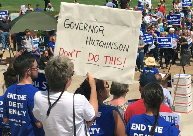 Protesters gather outside the state Capitol building on Friday, April 14, 2017, in Little Rock, Ark., to voice their opposition to Gov. Asa Hutchinson’s plan to put seven men to death between April 17, and April 27, 2017. Hundreds showed up for the rally. (AP Photo/Kelly P. Kissel)