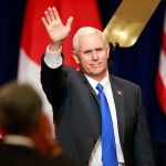 U.S. Vice President Mike Pence waves during a lecture for Japan-U.S. business leaders at a hotel in Tokyo, Wednesday, April 19, 2017. (AP Photo/Shizuo Kambayashi)