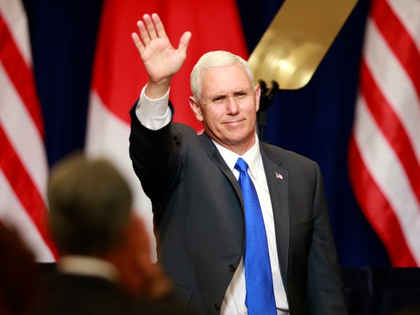 U.S. Vice President Mike Pence waves during a lecture for Japan-U.S. business leaders at a hotel in Tokyo, Wednesday, April 19, 2017. (AP Photo/Shizuo Kambayashi)