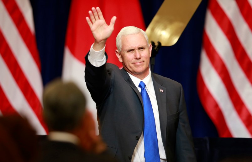 U.S. Vice President Mike Pence waves during a lecture for Japan-U.S. business leaders at a hotel in Tokyo, Wednesday, April 19, 2017. (AP Photo/Shizuo Kambayashi)