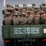 North Korean sit at the back of a truck as it drives along Mirae Scientists Street on Wednesday, April 19, 2017, in Pyongyang, North Korea which just celebrated its late leader Kim Il Sung's 105th birth anniversary with a military parade. (AP Photo/Wong Maye-E)
