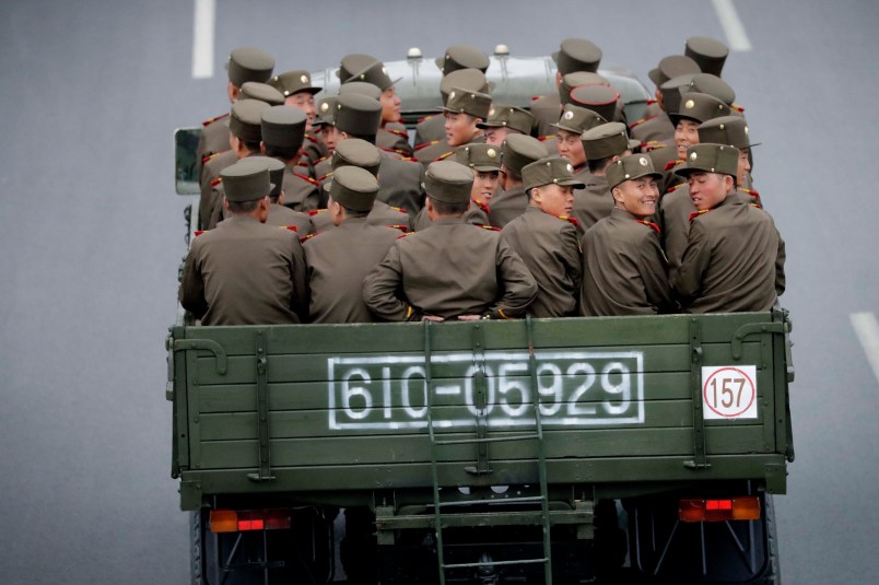 North Korean sit at the back of a truck as it drives along Mirae Scientists Street on Wednesday, April 19, 2017, in Pyongyang, North Korea which just celebrated its late leader Kim Il Sung's 105th birth anniversary with a military parade. (AP Photo/Wong Maye-E)