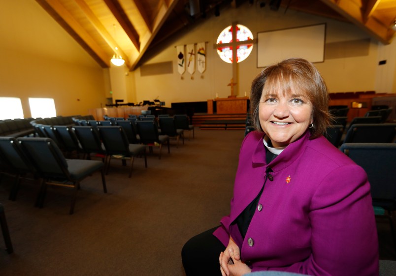 HOLD FOR RACHEL ZOLL STORY--In this Wednesday, April 19, 2017, photograph, Bishop Karen Oliveto is shown in the sanctuary of a United Methodist Church near her office in Highlands Ranch, Colo. Oliveto, who recently moved from San Francisco to Denver to be bishop for the United Methodist Church in a four-state region in the intermountain West, will face a church hearing next Tuesday, April 25, in Newark, N.J. The hearing is to determine whether the election violated church law barring the appointment of "self-avowed practicing homosexuals" since Oliveto is married to a woman.  (AP Photo/David Zalubowski)