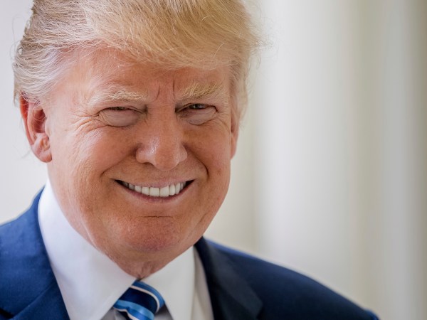 President Donald Trump poses for a photograph on West Wing Colonnade at the White House in Washington, Friday, April 21, 2017.  (AP Photo/Andrew Harnik)