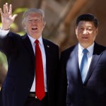 President Donald Trump and Chinese President Xi Jinping pause for photographs at Mar-a-Lago, Friday, April 7, 2017, in Palm Beach, Fla. Trump was meeting again with his Chinese counterpart Friday, with U.S. missile strikes on Syria adding weight to his threat to act unilaterally against the nuclear weapons program of China's ally, North Korea. (AP Photo/Alex Brandon)