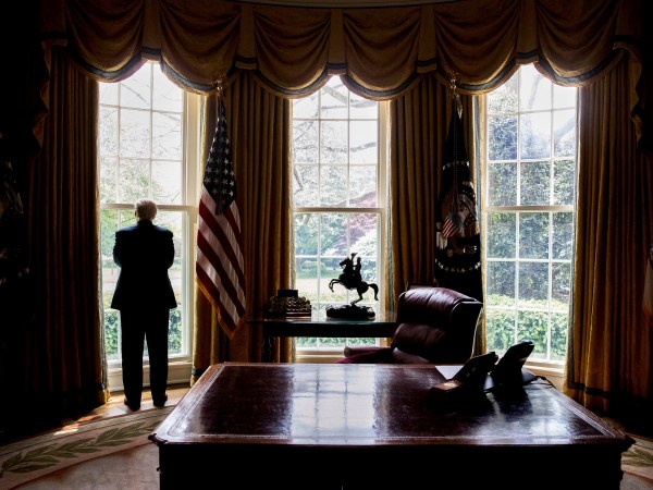 HOLD FOR STORY: TRUMP 100-EDUCATION OF DONALD TRUMP -- President Donald Trump looks out an Oval Office window at the White House after an Associated Press interview Friday, April 21, 2017 in Washington. (AP Photo/Andrew Harnik)