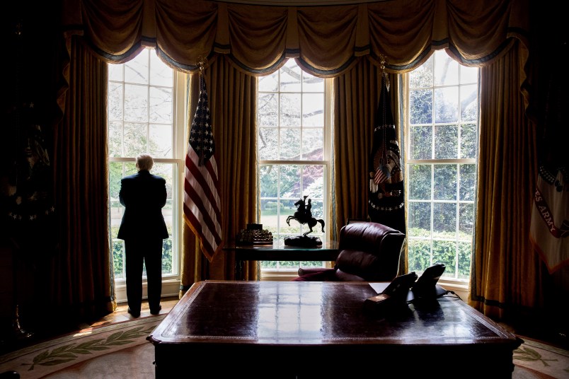 HOLD FOR STORY: TRUMP 100-EDUCATION OF DONALD TRUMP -- President Donald Trump looks out an Oval Office window at the White House after an Associated Press interview Friday, April 21, 2017 in Washington. (AP Photo/Andrew Harnik)