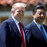 President Donald Trump and Chinese President Xi Jinping walk together after their meetings at Mar-a-Lago, Friday, April 7, 2017, in Palm Beach, Fla. (AP Photo/Alex Brandon)