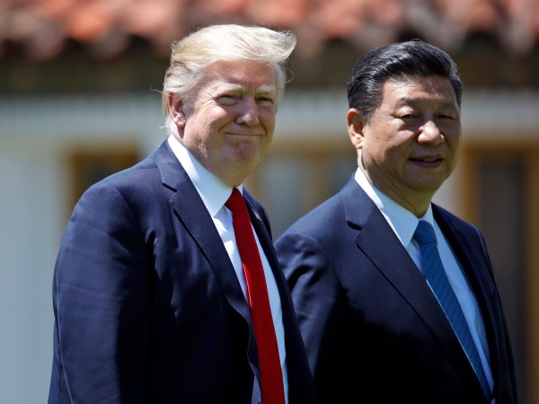 President Donald Trump and Chinese President Xi Jinping walk together after their meetings at Mar-a-Lago, Friday, April 7, 2017, in Palm Beach, Fla. (AP Photo/Alex Brandon)
