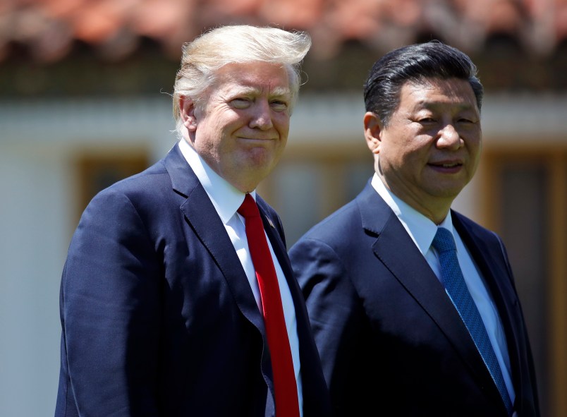 President Donald Trump and Chinese President Xi Jinping walk together after their meetings at Mar-a-Lago, Friday, April 7, 2017, in Palm Beach, Fla. (AP Photo/Alex Brandon)