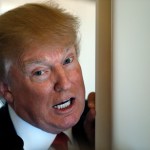 President Donald Trump speaks with reporters on Air Force One while in flight from Andrews Air Force Base, Md., to Palm Beach International Airport, Fla., Thursday, April 6, 2017. (AP Photo/Alex Brandon)