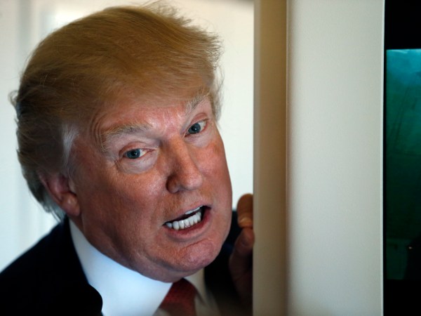 President Donald Trump speaks with reporters on Air Force One while in flight from Andrews Air Force Base, Md., to Palm Beach International Airport, Fla., Thursday, April 6, 2017. (AP Photo/Alex Brandon)
