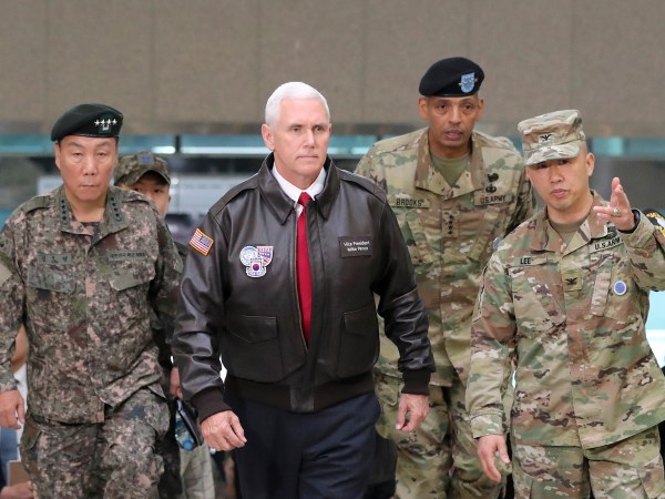 U.S. Vice President Mike Pence arrives with U.S. Gen. Vincent Brooks, second from right, commander of the United Nations Command, US Forces Korea and Combined Forces Command, and South Korean Deputy Commander of the Combined Force Command Gen. Leem Ho-young, left, at the border village of Panmunjom in the Demilitarized Zone (DMZ) which has separated the two Koreas since the Korean War, South Korea, Monday, April 17, 2017.  Viewing his adversaries in the distance, U.S. Vice President Mike Pence traveled to the tense zone dividing North and South Korea and warned Pyongyang that after years of testing the U.S. and South Korea with its nuclear ambitions, "the era of strategic patience is over." (AP Photo/Lee Jin-man)