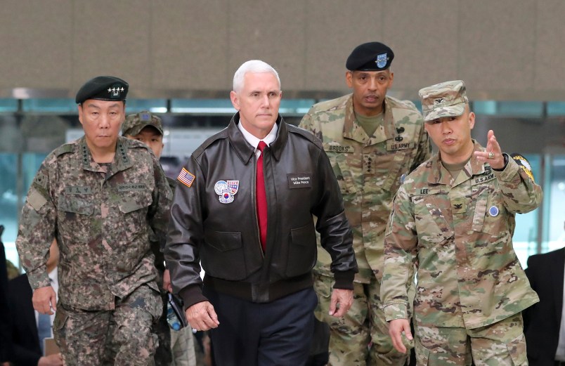 U.S. Vice President Mike Pence arrives with U.S. Gen. Vincent Brooks, second from right, commander of the United Nations Command, US Forces Korea and Combined Forces Command, and South Korean Deputy Commander of the Combined Force Command Gen. Leem Ho-young, left, at the border village of Panmunjom in the Demilitarized Zone (DMZ) which has separated the two Koreas since the Korean War, South Korea, Monday, April 17, 2017.  Viewing his adversaries in the distance, U.S. Vice President Mike Pence traveled to the tense zone dividing North and South Korea and warned Pyongyang that after years of testing the U.S. and South Korea with its nuclear ambitions, "the era of strategic patience is over." (AP Photo/Lee Jin-man)