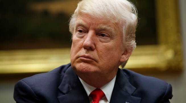 President Donald Trump listens during a meeting with the National Association of Manufacturers in the Roosevelt Room of the White House, Friday, March 31, 2017, in Washington. (AP Photo/Evan Vucci)