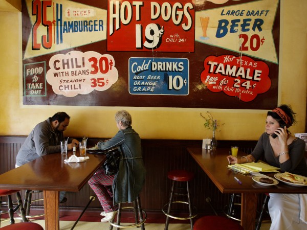 Nickel Diner patrons, left are seen at the downtown Los Angeles restaurant on Thursday, April 2, 2009. Far right, co-owner Monica May. The diner which opened in September and was named one of last year's best new restaurants by Los Angeles magazine. While most construction has halted downtown, smaller business are staking a future on streets once largely empty after office workers went home and bordered by Skid Row's massive homeless population. (AP Photo/Damian Dovarganes)