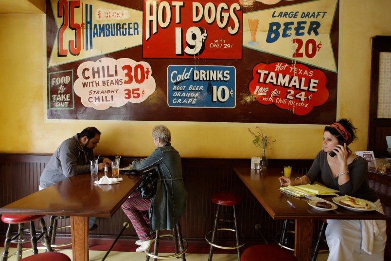 Nickel Diner patrons, left are seen at the downtown Los Angeles restaurant on Thursday, April 2, 2009. Far right, co-owner Monica May. The diner which opened in September and was named one of last year's best new restaurants by Los Angeles magazine. While most construction has halted downtown, smaller business are staking a future on streets once largely empty after office workers went home and bordered by Skid Row's massive homeless population. (AP Photo/Damian Dovarganes)