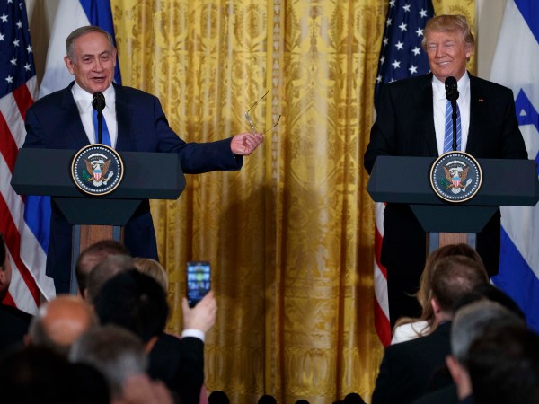 FILE - In this Wednesday, Feb. 15, 2017 file photos, President Donald Trump listens as Israeli Prime Minister Benjamin Netanyahu speaks during their joint news conference in the East Room of the White House,  in Washington. Trump and Netanyahu said at their first joint news conference that they will seize what they believe is an opportunity for an ambitious Israeli-Arab peace deal. (AP Photo/Evan Vucci, File)