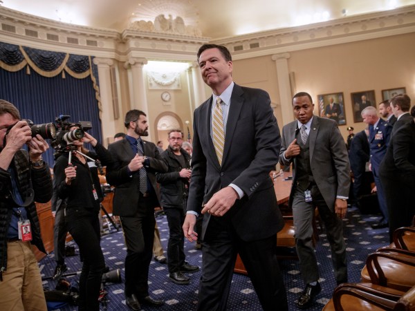 FBI Director James Comey takes a break after three hours of testifying as the House Permanent Select Committee on Intelligence holds its first public hearing on allegations of Russian interference in the 2016 U.S. presidential election and the murky web of contacts between President Donald Trump's campaign and Russia, on Capitol Hill in Washington, Monday, March 20, 2017. (AP Photo/J. Scott Applewhite)