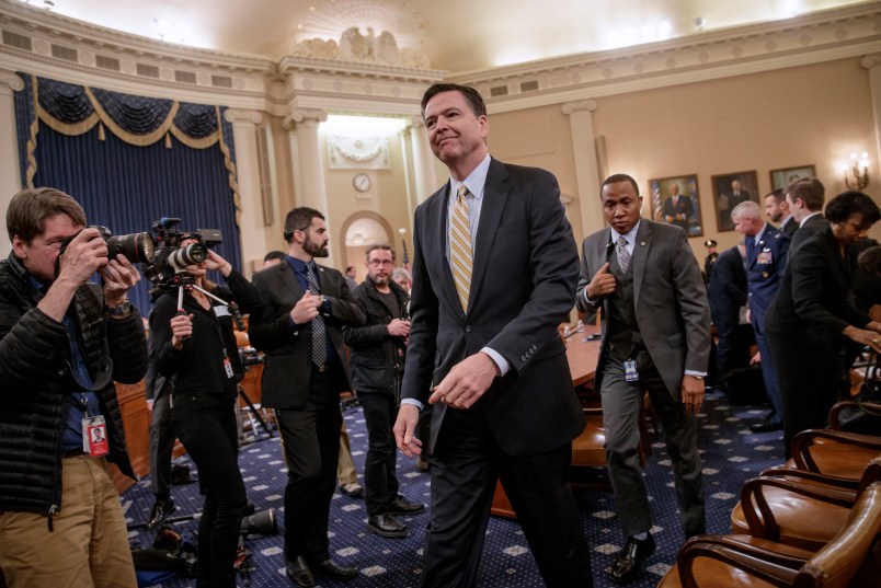 FBI Director James Comey takes a break after three hours of testifying as the House Permanent Select Committee on Intelligence holds its first public hearing on allegations of Russian interference in the 2016 U.S. presidential election and the murky web of contacts between President Donald Trump's campaign and Russia, on Capitol Hill in Washington, Monday, March 20, 2017. (AP Photo/J. Scott Applewhite)