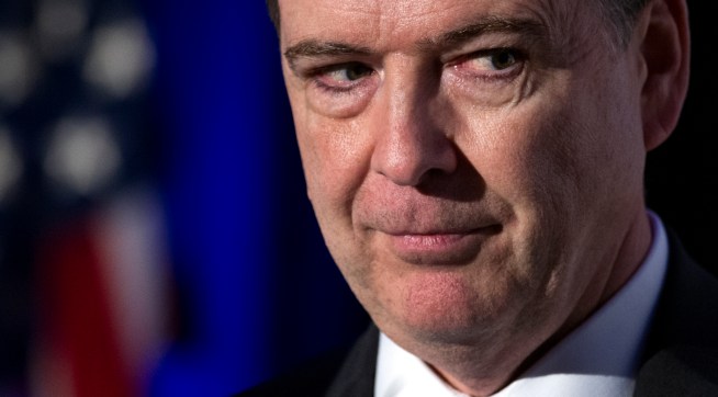 FBI Director James Comey adddresses the Intelligence and National Security Alliance Leadership Dinner in Alexandria, Va., Wednesday, March 29, 2017. (AP Photo/Cliff Owen)