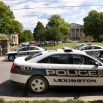 Police officers at the scene of a stabbing on the Transylvania University campus in Lexington, Ky., Friday, April 28, 2017. A student was injured and another was arrested after a machete attack Friday morning at a Transylvania University coffee shop, according to Lexington police. The assailant, thought to be a former student, was armed with a machete and knives, Lexington Police Chief Mark Barnard said. The university canceled classes for the rest of the day. The stabbing occurred at a coffee shop inside the Glenn Building, on the left.