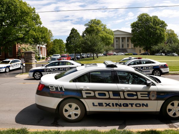 Police officers at the scene of a stabbing on the Transylvania University campus in Lexington, Ky., Friday, April 28, 2017. A student was injured and another was arrested after a machete attack Friday morning at a Transylvania University coffee shop, according to Lexington police. The assailant, thought to be a former student, was armed with a machete and knives, Lexington Police Chief Mark Barnard said. The university canceled classes for the rest of the day. The stabbing occurred at a coffee shop inside the Glenn Building, on the left.
