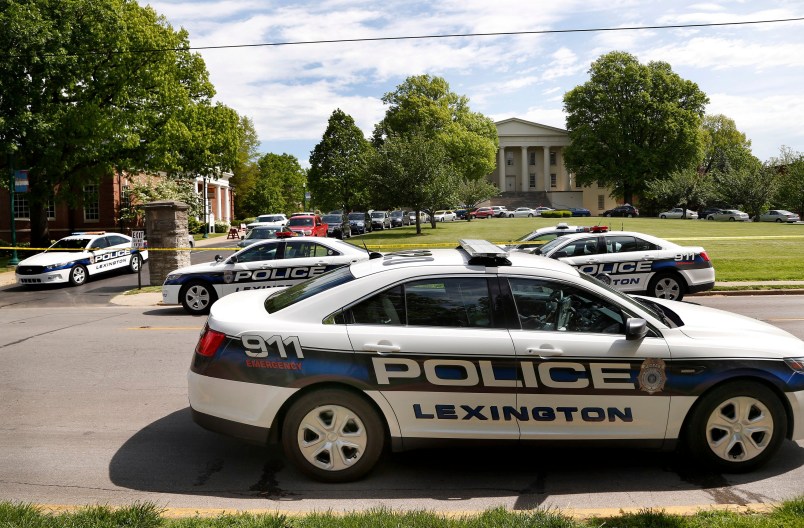 Police officers at the scene of a stabbing on the Transylvania University campus in Lexington, Ky., Friday, April 28, 2017. A student was injured and another was arrested after a machete attack Friday morning at a Transylvania University coffee shop, according to Lexington police. The assailant, thought to be a former student, was armed with a machete and knives, Lexington Police Chief Mark Barnard said. The university canceled classes for the rest of the day. The stabbing occurred at a coffee shop inside the Glenn Building, on the left.