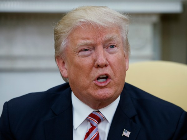 President Donald Trump talks to reporters during a meeting with former Secretary of State Henry Kissinger in the Oval Office of the White House, Wednesday, May 10, 2017, in Washington. (AP Photo/Evan Vucci)
