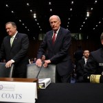 CIA Director Mike Pompeo, left, and Director of National Intelligence Dan Coats, take their seats next to National Security Agency Director Adm. Michael Rogers, during a Senate Intelligence Committee hearing, on Capitol Hill in Washington, Thursday, May 11, 2017. It is an annual hearing about the major threats facing the U.S., but former FBI Director Jim Comey's sudden firing is certain to be a focus of questions. (AP Photo/Jacquelyn Martin)