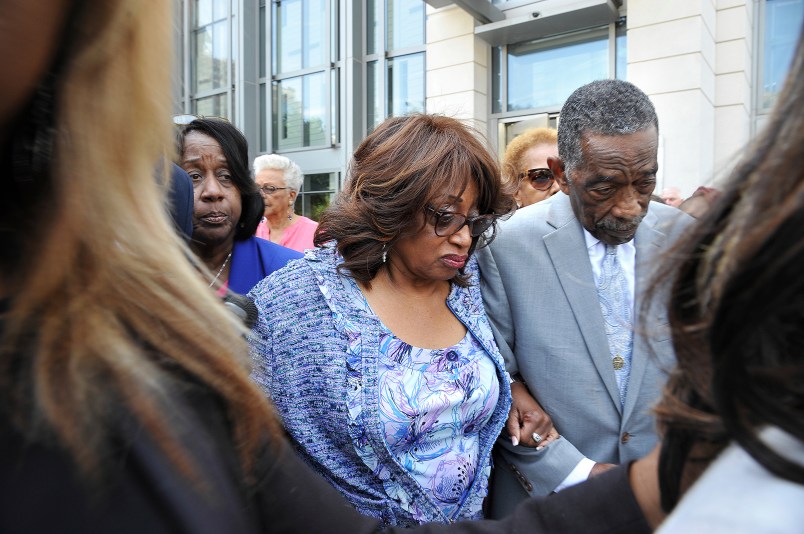 Bishop Rudolph W. McKissick, Sr. (left) escorts Former Congresswoman Corrine Brown (right) leaves the Bryan Simpson United States Courthouse on the arm of Bishop Rudolph W. McKissick, Sr. after being found guilty on 18 of 22 counts. (AP Photo/Bruce Lipsky/Florida Times-Union)