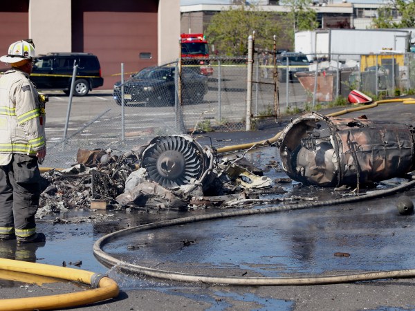 A fire fighter stands near parts of the plane. A plane crashes along Kero Rd. just south of Teterboro Airport Monday afternoon.   Monday May 15, 2017. Carlstadt, NJ, USA  (Aristide Economopoulos | NJ Advance Media for NJ.com)
