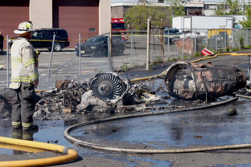 A fire fighter stands near parts of the plane. A plane crashes along Kero Rd. just south of Teterboro Airport Monday afternoon.   Monday May 15, 2017. Carlstadt, NJ, USA  (Aristide Economopoulos | NJ Advance Media for NJ.com)