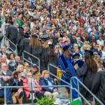 Notre Dame graduates walk out of Notre Dame Stadium in protest as Vice President Mike Pence begins to speak for the 2017 commencement ceremony Sunday, May 21, 2017, in South Bend, Ind. (Robert Franklin/South Bend Tribune via AP)