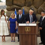 U.S. President Donald Trump signs the guest book at the Yad Vashem Holocaust Museum in Jerusalem, Israel, May 23, 2017. He is joined by his wife Melania, Sara Netanyahu, Israeli Prime Minister Benjamin Netanyahu and Yad Vashem Chairman Avner Shalev.  POOL  Photo by Debbie Hill/UPI
