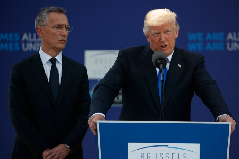 NATO Secretary General Jens Stoltenberg listens as President Donald Trump speaks during a ceremony to unveil artifacts from the World Trade Center and Berlin Wall for the new NATO headquarters, Thursday, May 25, 2017, in Brussels. (AP Photo/Evan Vucci)