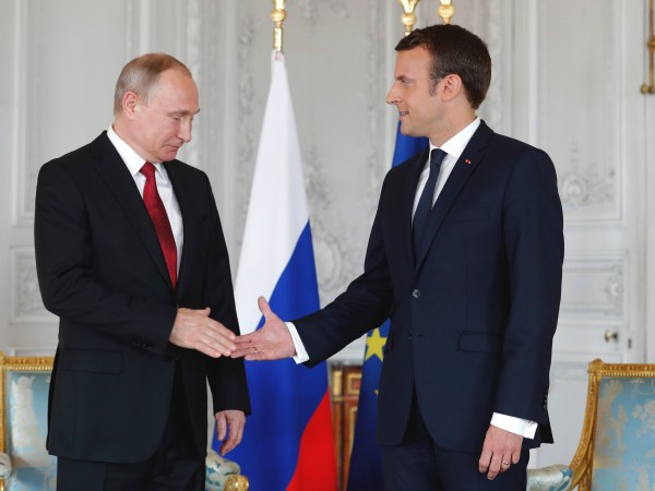 President Emmanuel Macron, right,  shakes hands with his Russian counterpart Vladimir Putin as they meet for talks before the opening of an exhibition marking 300 years of diplomatic ties between the two countyies at Palace of Versailles in Versailles, near Paris, France, Monday, May 29, 2017. Monday's meeting comes in the wake of the Group of Seven's summit over the weekend where relations with Russia were part of the agenda, making Macron the first Western leader to speak to Putin after the talks. (Philippe Wojazer/Pool Photo via AP)