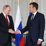 President Emmanuel Macron, right,  shakes hands with his Russian counterpart Vladimir Putin as they meet for talks before the opening of an exhibition marking 300 years of diplomatic ties between the two countyies at Palace of Versailles in Versailles, near Paris, France, Monday, May 29, 2017. Monday's meeting comes in the wake of the Group of Seven's summit over the weekend where relations with Russia were part of the agenda, making Macron the first Western leader to speak to Putin after the talks. (Philippe Wojazer/Pool Photo via AP)